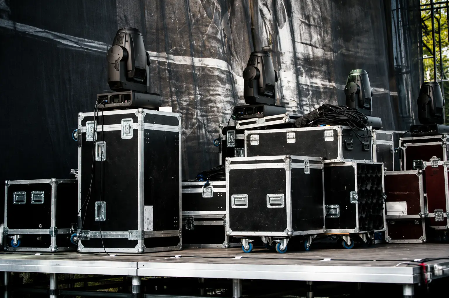 Stage lighting fixtures rigged above a stage