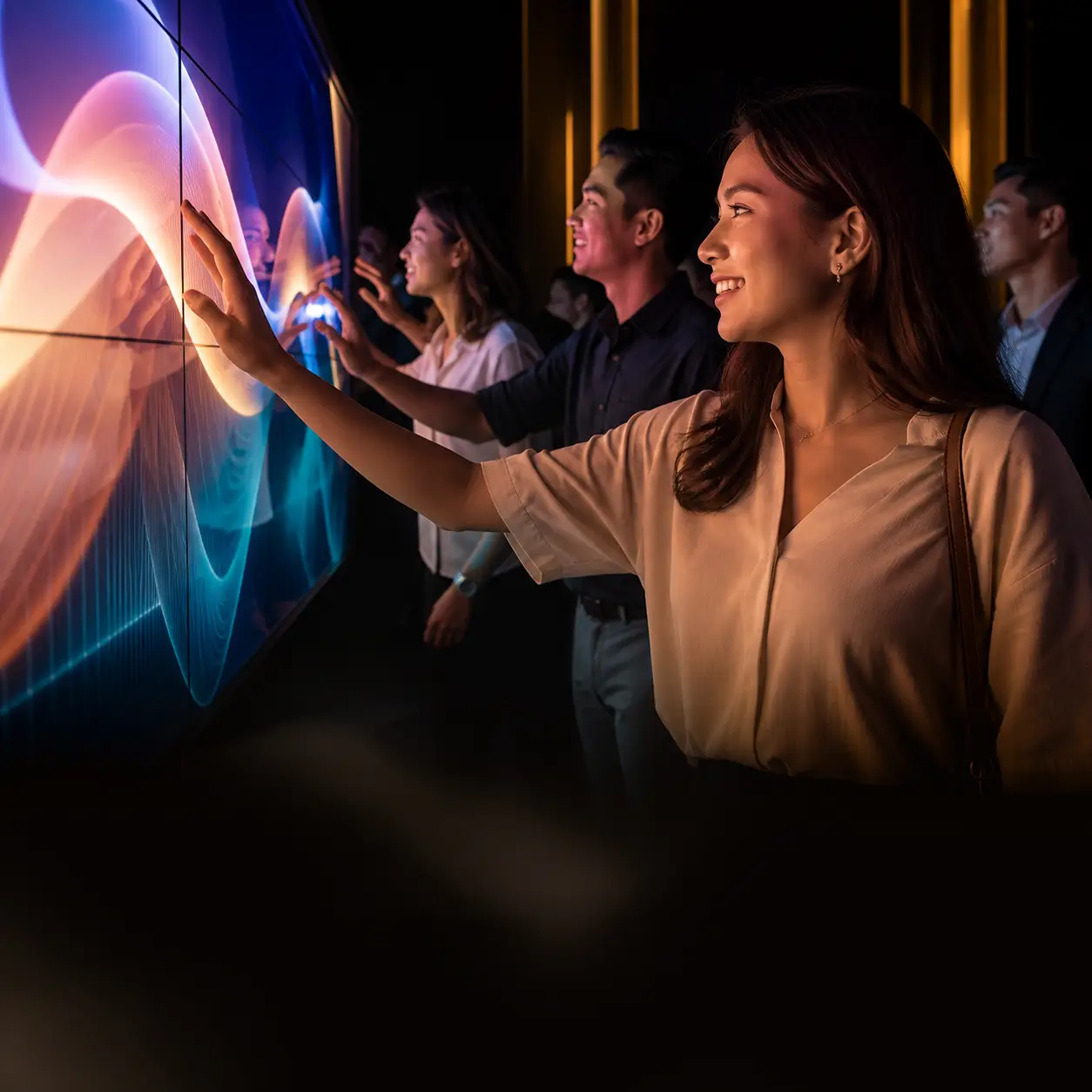 Guests using an interactive touchscreen wall